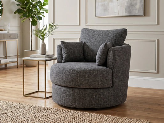 Gamzo Outlet Lisbon fabric swivel corner chair with plush upholstery and modern design, shown in a cozy living room setting.