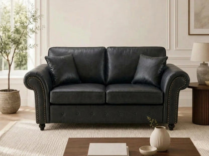 Black leather Gamzo Outlet Oakland full back 2-seater sofa with plush cushions and wooden legs for comfortable seating.