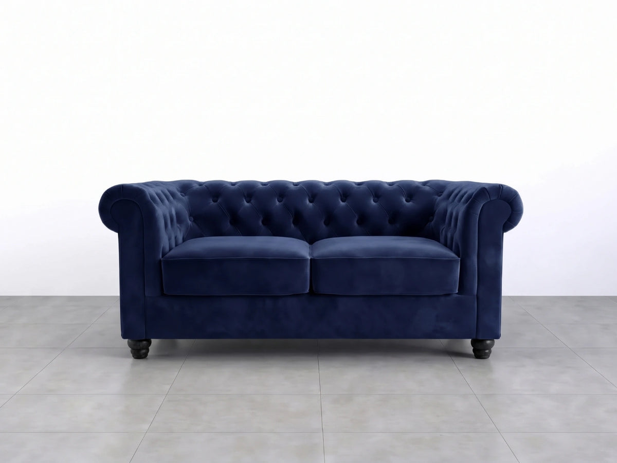 Midnight blue Chesterfield plush velvet fabric sofa set, two-seater with tufted design and elegant rolled arms.