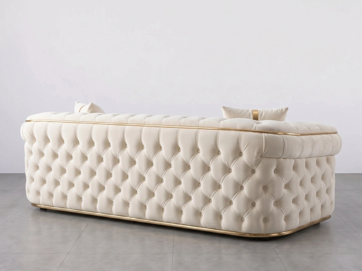 Cream Gamzo Outlet Chesterfield sofa set 2-seater with tufted cushions and rolled arms in a stylish living room setting.