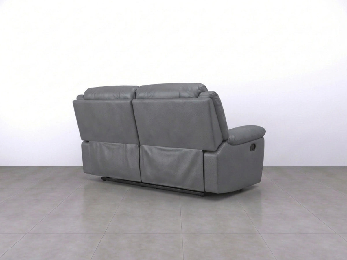 Gray Model R Recliner Sofa by Gamzo Outlet, two-seater with plush cushions and modern design, shown in a relaxed seated position.