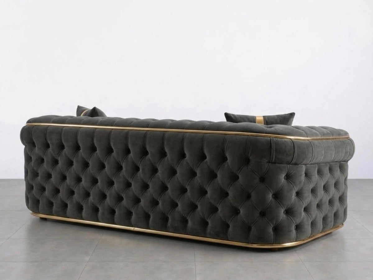 Dark grey Gamzo Outlet Chesterfield sofa set with a plush 3-seater and 2-seater, featuring classic tufted upholstery and elegant design.