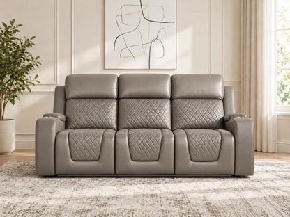Grey Model B electric recliner sofa by Gamzo Outlet, three-seater with plush cushions and reclining features visible.
