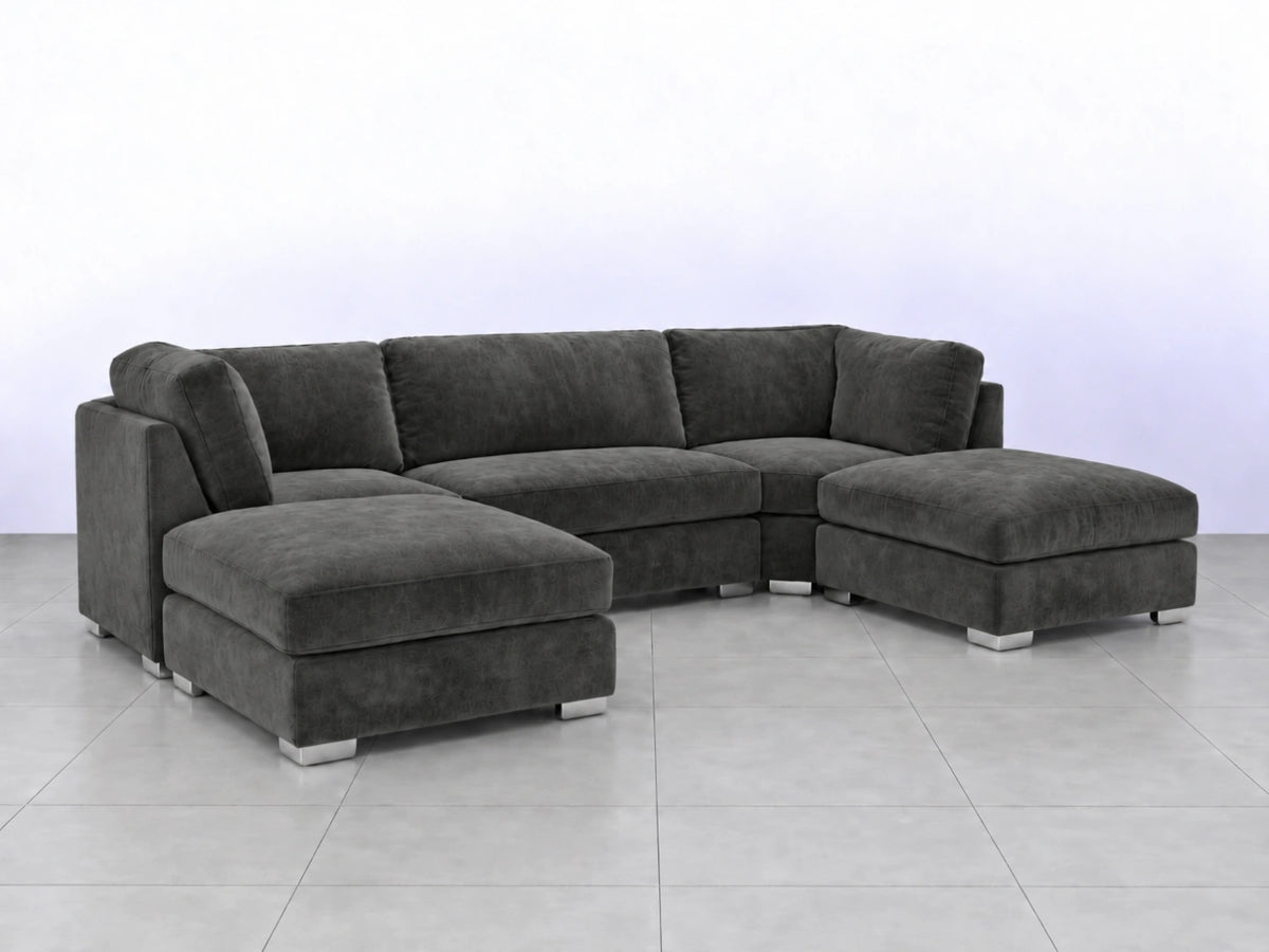 Dark grey U-shaped furniture piece by Gamzo Outlet with smooth curves and modern design, shown from a side angle.