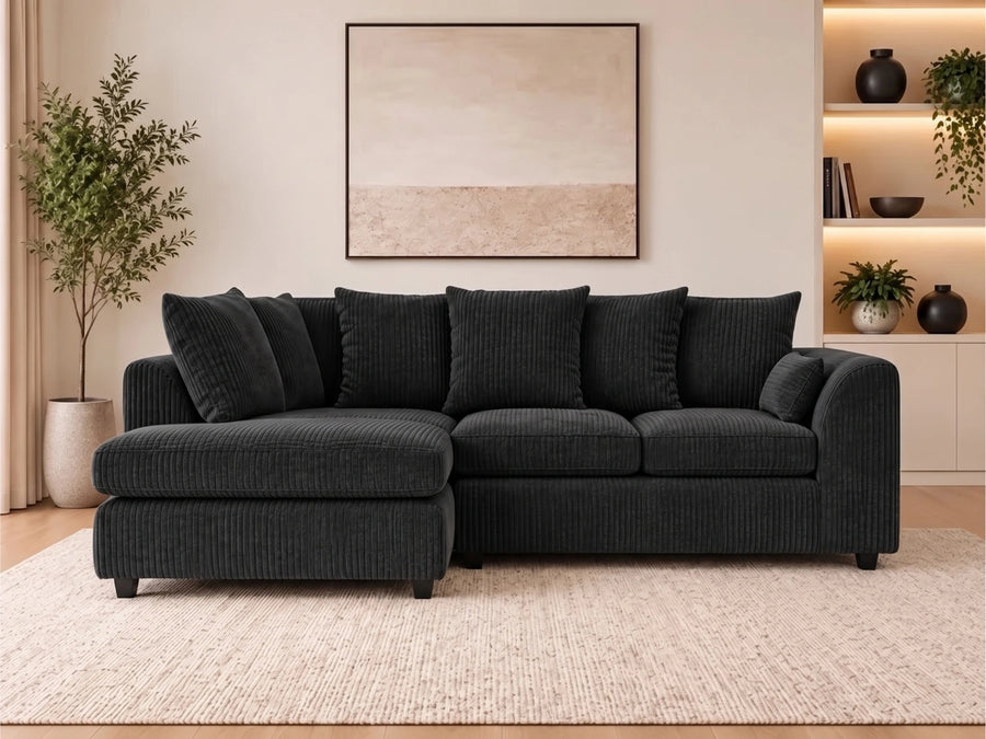 Black L-shaped sofa with jumbo cord fabric, scatter back cushions, and left-hand facing design by Gamzo Outlet.