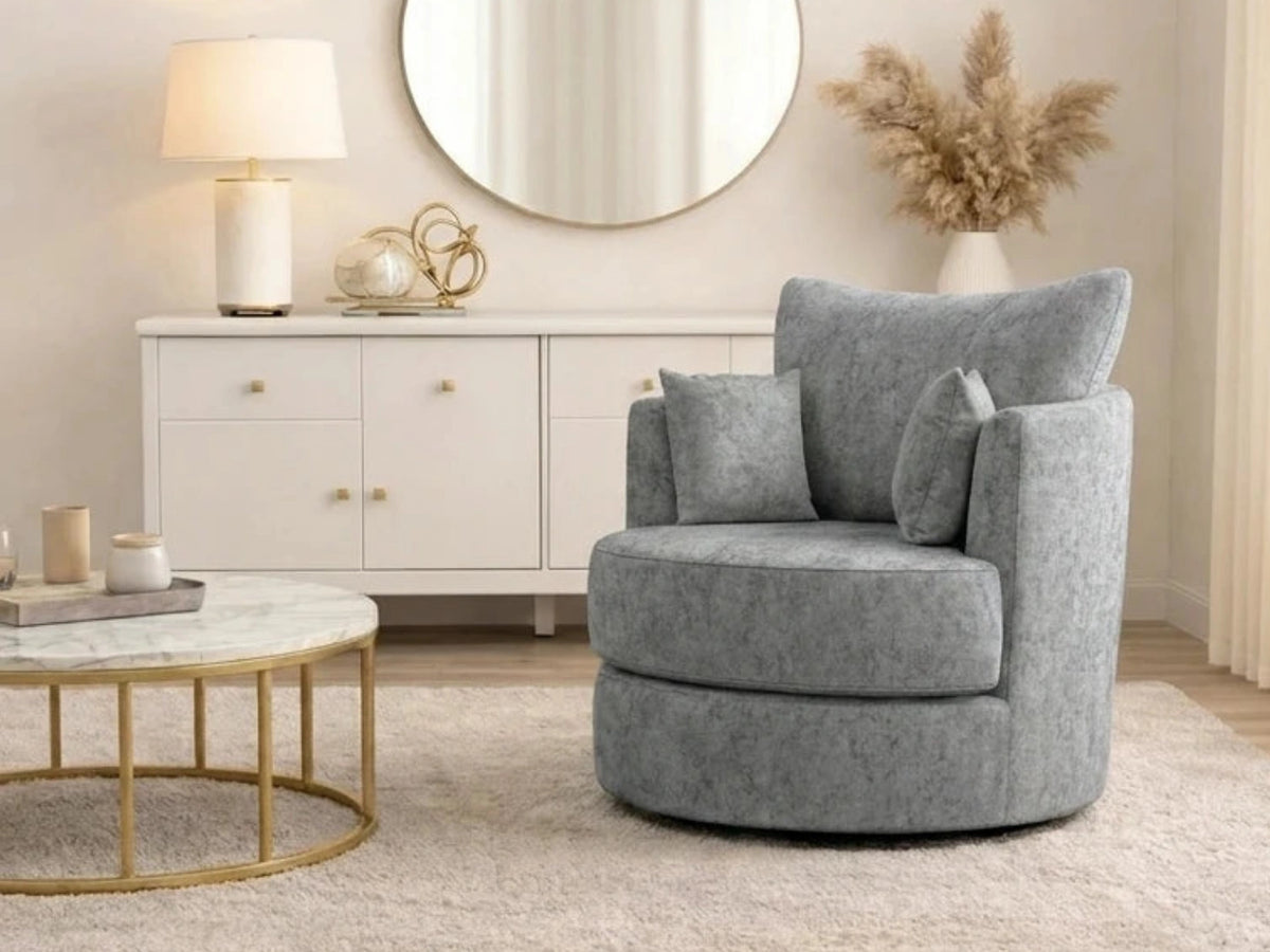 Light grey Gamzo Outlet Alaska Fabric Swivel Chair with a modern design and cushioned seat, shown from a side angle.
