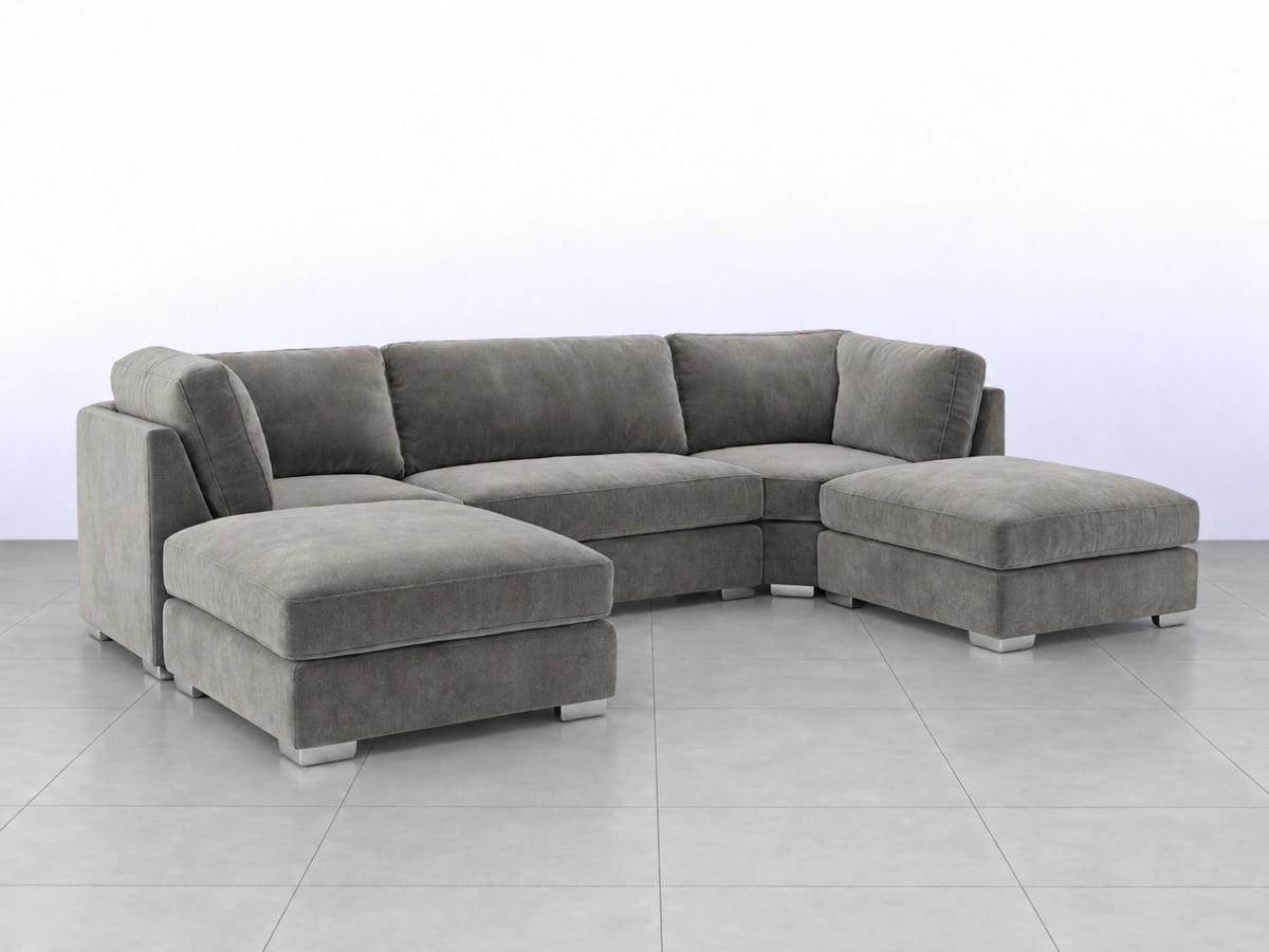 Light grey U-shaped sofa from Gamzo Outlet, showcasing a modern, comfortable lounge design with plush cushions and sleek style.