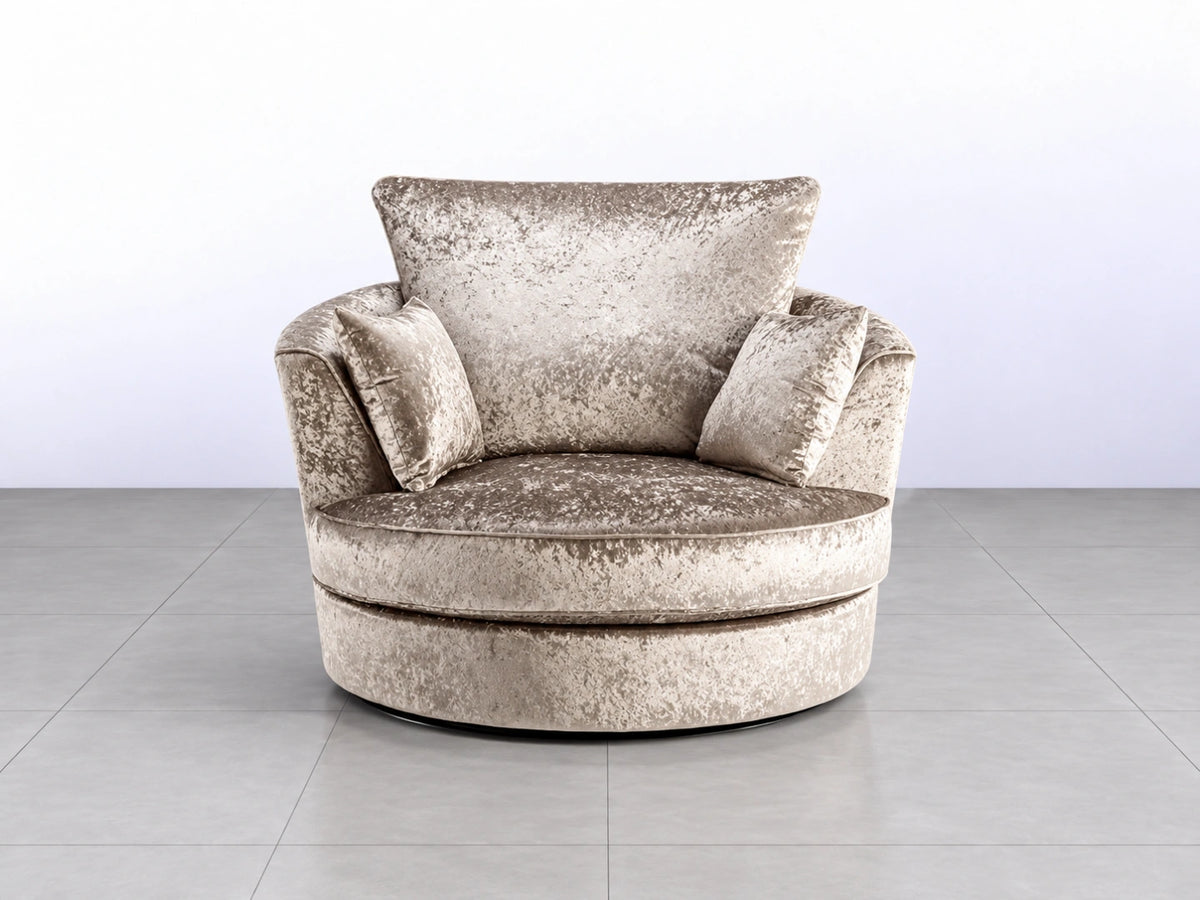 Crushed velvet swivel corner chair in soft misty pink with plush upholstery and modern design.