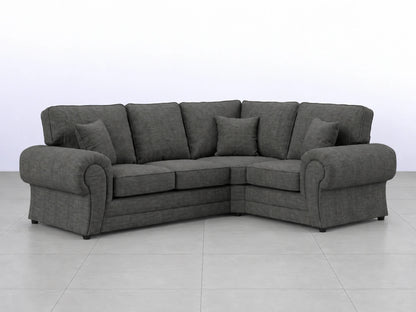 Grey fabric L-shaped sofa from Gamzo Outlet, showing plush cushions and modern design in a cozy living room setting.