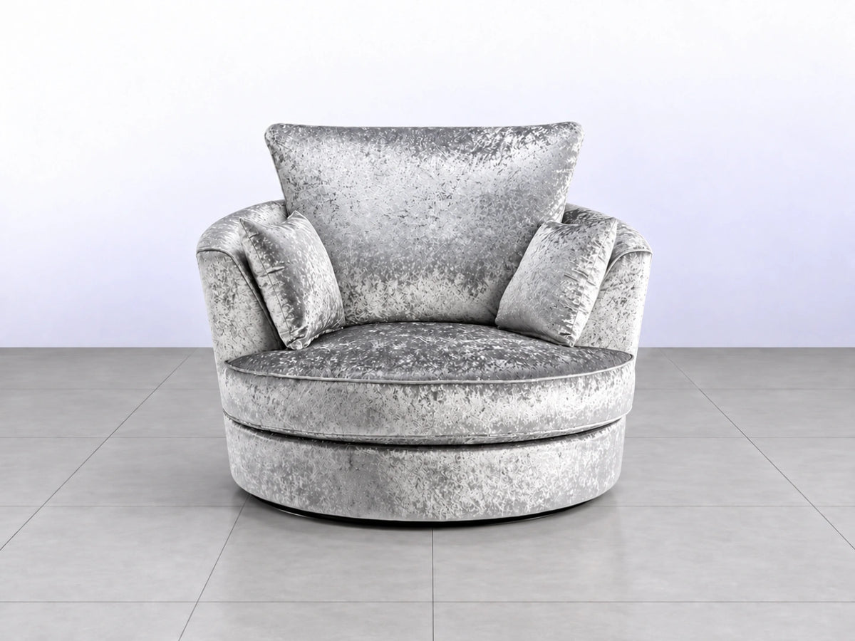 Silver crushed velvet swivel corner chair with modern design, featuring a sleek silver finish and plush upholstery.