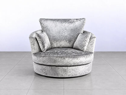 Silver crushed velvet swivel corner chair with modern design, featuring a sleek silver finish and plush upholstery.
