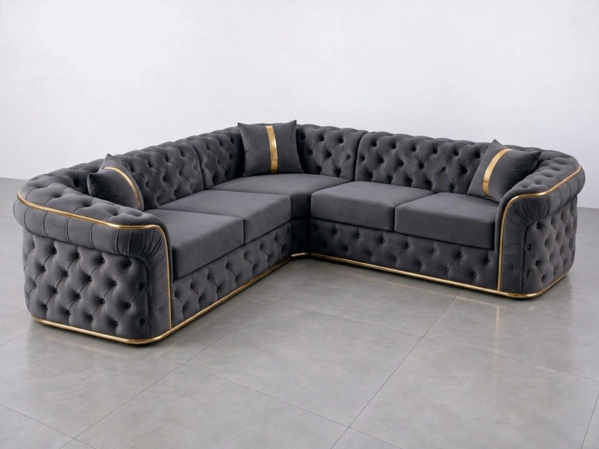 Dark grey Chesterfield corner sofa by Gamzo Outlet with tufted upholstery and plush cushions, ideal for modern living rooms.