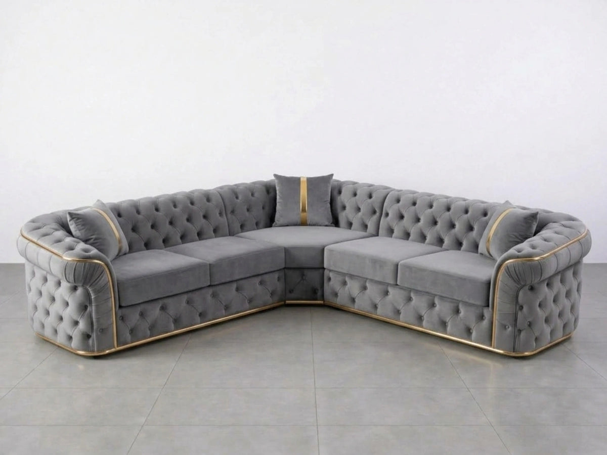 Light grey Chesterfield corner sofa by Gamzo Outlet with tufted upholstery and plush cushions in a modern living room setting.