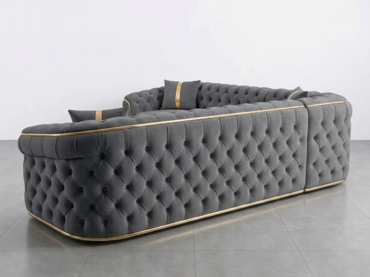 Light grey Chesterfield corner sofa by Gamzo Outlet, showing plush upholstery and classic rolled arms in a modern living room setting.
