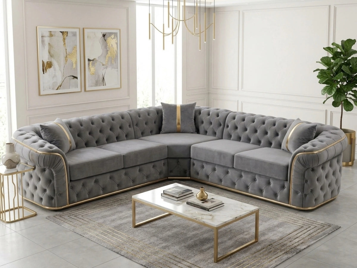 Light grey Chesterfield corner sofa by Gamzo Outlet, showcasing plush upholstery and elegant rolled arms in a stylish living room setting.