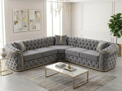 Light grey Chesterfield corner sofa by Gamzo Outlet, showcasing plush upholstery and elegant rolled arms in a stylish living room setting.