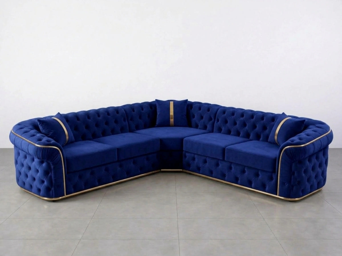 Midnight blue Chesterfield corner sofa by Gamzo Outlet with tufted upholstery and plush cushions in a modern living room setting.