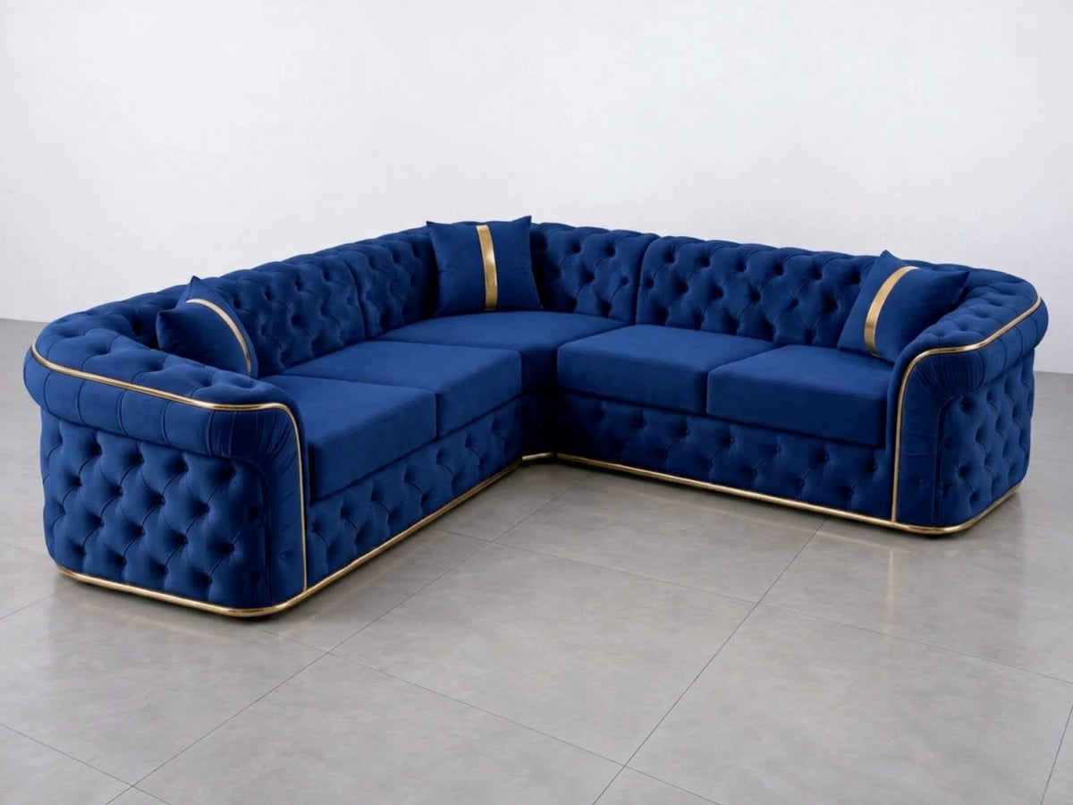 Midnight blue Chesterfield corner sofa by Gamzo Outlet with tufted upholstery and plush cushions in a stylish living room setting.