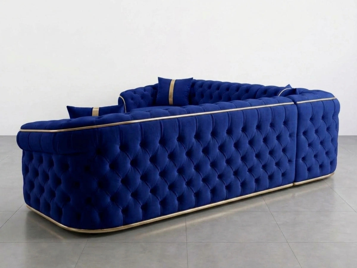 Gamzo Outlet Chesterfield corner sofa in midnight blue fabric, showcasing plush cushions and elegant tufted design.