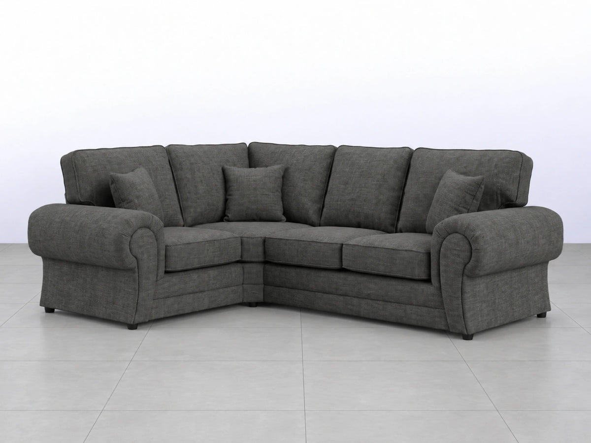 Grey Wilcot fabric L-shaped sofa by Gamzo Outlet, shown from the left side with plush cushions and modern design.