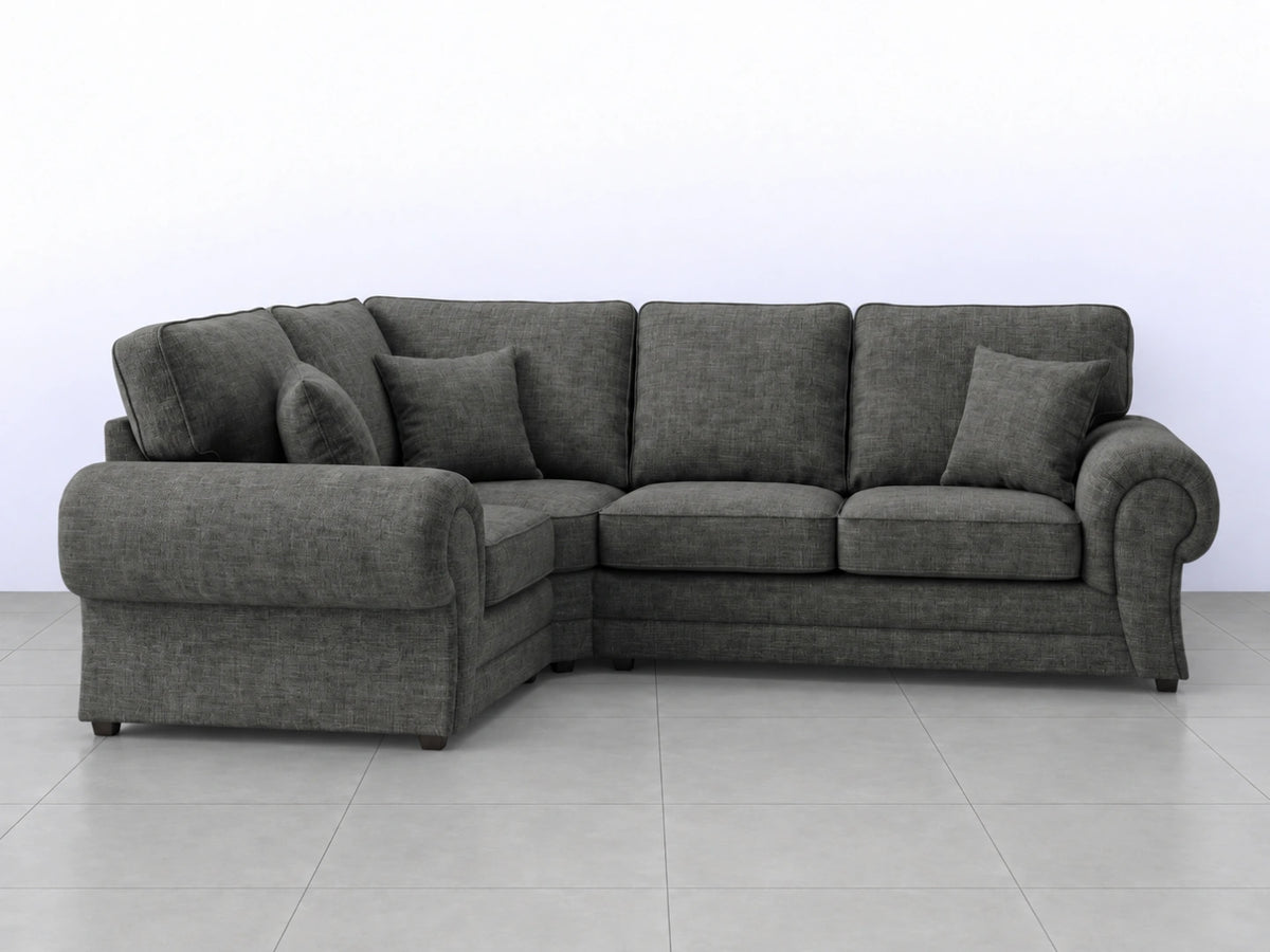 Grey Wilcot fabric L-shaped sofa by Gamzo Outlet, showing the left-hand corner and plush seating in a modern living room setting.